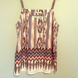 Chiffon tank with back cutout detail.